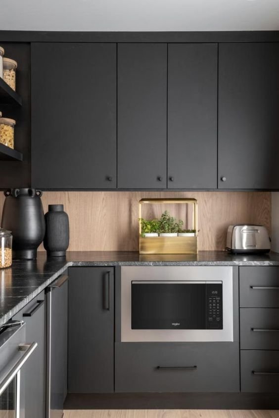 Black Cabinets with Hidden Appliances for a Seamless Look