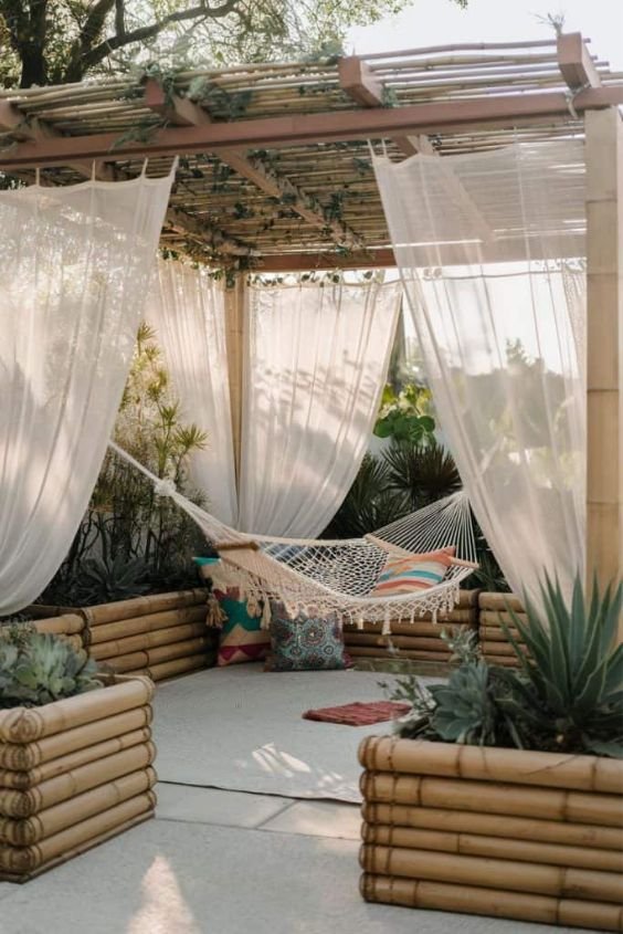 Boho-Chic Pergola with Drapes and Lanterns